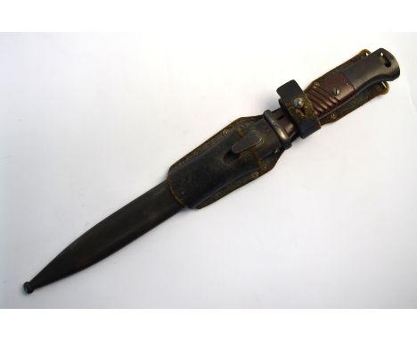 A WW II Third Reich K98 bayonet, the single fuller 250 mm blade stamped 44 crs and No. 1520e, with ribbed crips c/with matchi