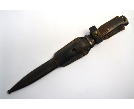 A WW II Third Reich K98 bayonet, the single fuller 250 mm blade stamped 44 crs and No. 1520e, with ribbed crips c/with matchi