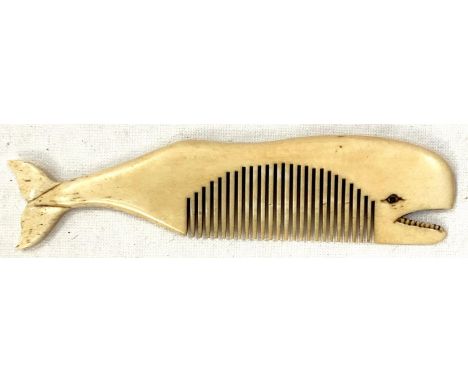 A scrimshaw whalebone comb carved in the form of a whale, length 11cm.It seems in good condition with carving of the teeth an