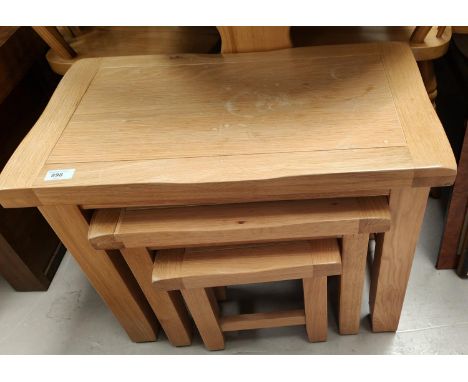 A light oak nest of 3 tables 
