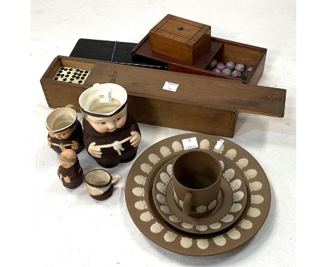 A Wedgwood brown stoneware trio set; 4 Goebels monks, 2 boxed sets of dominoes; a card box and a box of vintage marbles 