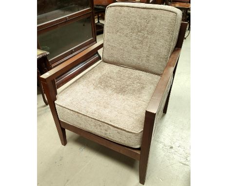 A modern open armchair in light brown fabric 