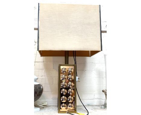 A modernist table lamp in gilt metal with dimpled mirror glass 