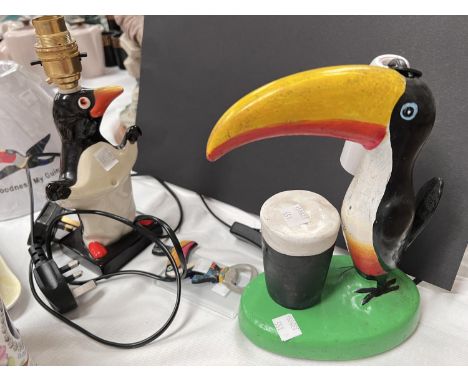 A Carlton ware Guinness penguin lamp, another similar Toucan Carlton ware style lamp, etc