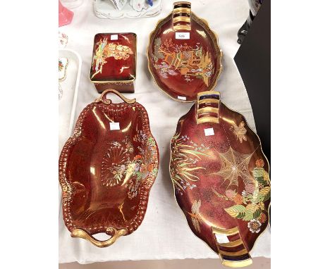 A Carltonware pair of oval red lustre dishes decorated with a pagoda and spider respectively, length 31cm (1 with 2 rim chips