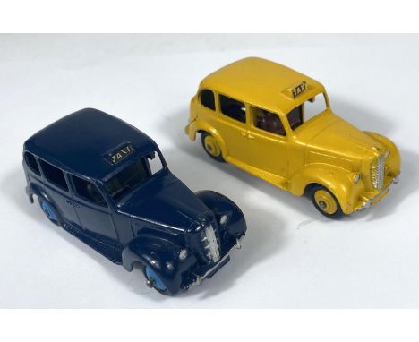 DINKY TOYS: 254/40H Austin Taxi in dark blue colourway with light blue hub caps and matt black under carriage; a Dinky 254/40