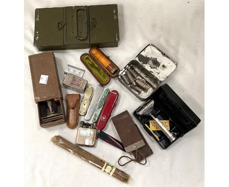 A selection of bric-a-brac:&nbsp; old razors; cigar holders; a lighter; penknives; etc. 