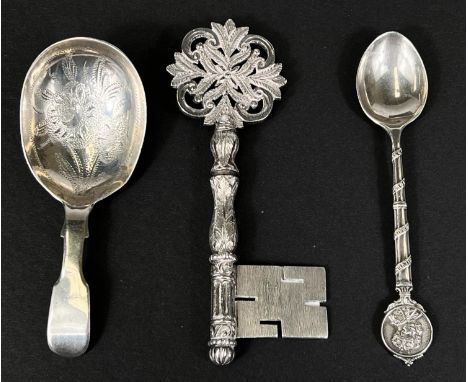 A silver Victorian caddy spoon, a 1935 GV commemorative silver spoon and a silver key 