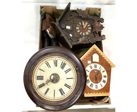 A 19th century Postman's Alarm; a black forest cuckoo clock; similar clocks 