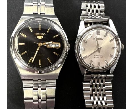 Two gent's vintage stainless steel watches on stainless steel bracelets 
