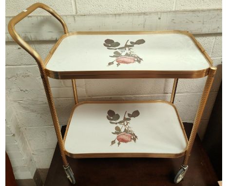 A nest of 3 reproduction mahogany tables and another occasional table: a vintage gilt drinks trolley and a red storage box 