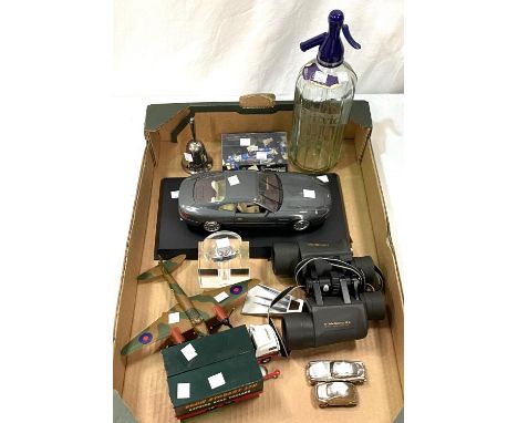 A selection of collectors items:&nbsp; binoculars; soda siphon; camera; model cars; etc. 
