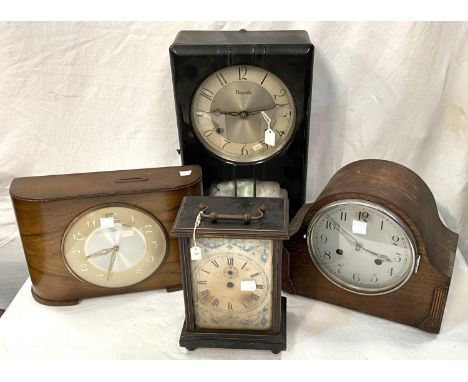 A 1950's 'Savings' mantel clock in walnut case with coin slot; a 1930's mantel clock with strike in oak case; a 'carriage' st
