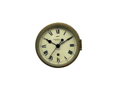 A 20th century English ships bulkhead clock having a 6” dial with roman numerals, five-minute Arabic’s and minute track, with