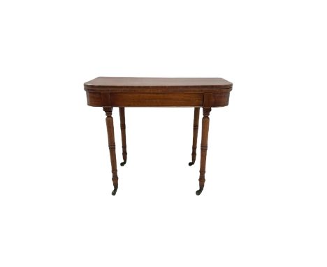 Early 19th century mahogany card table, fold-over top with baize lined interior, on turned supports with brass castorsDimensi