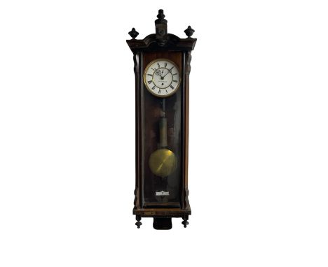 A Gustav Becker (German) late 19th century single weight driven Vienna regulator in a mahogany and ebonised case with a carve