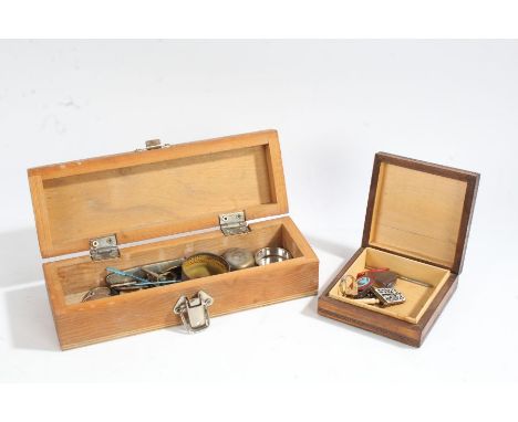 Two wooden boxes of curio's to include a enamel badges, Mini Hadson gas lighter, silver plated coin case etc., (2)