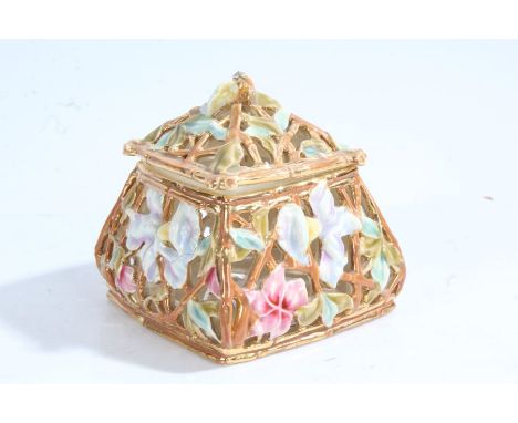 Zsolnay porcelain pot and cover, with a pierced foliate decoration in blue and red on a gold ground, 10cm diameter by 10cm hi