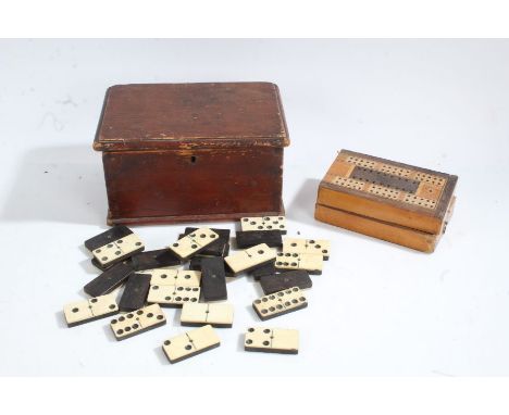 Stained pine box with contents of bone dominoes and an inlaid cribbage board