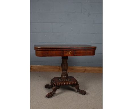 Early 19th century mahogany and brass inlaid fold over card table, the top decorated with brass inlaid opening to reveal a bu