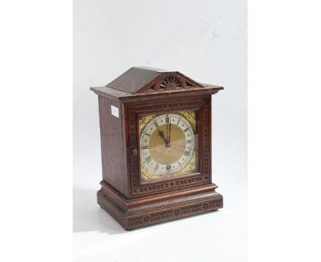 Winterhalder &amp; Hofmeier oak bracket or table clock, the gilt dial with a silvered chapter ring and cherubs to the corners