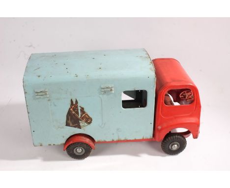 Tri-ang tinplate horse box, in light blue and red, containing two horse46.5cm long