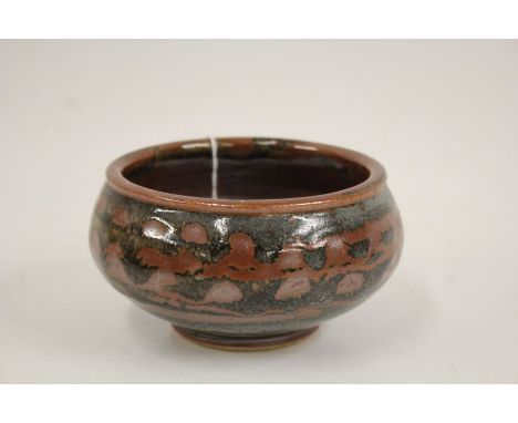 John Leach for Muchelney Pottery, a squat bowl, the bulbous body with wax resist decoration, stamped "08" to foot, 14cm diame