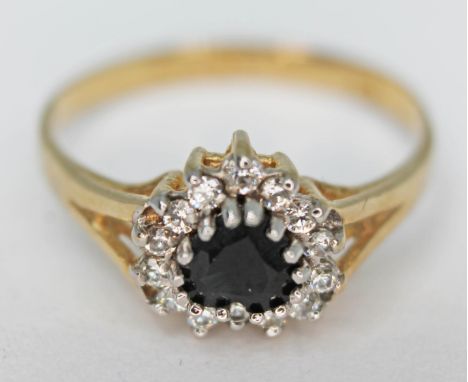 A 9ct gold heart shaped cluster ring, gross wt. 1.4g, size K.  
