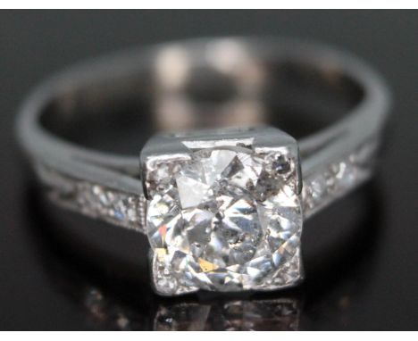 An Art Deco diamond solitaire ring circa 1920s, the central round brilliant cut stone approx. 1.71 carats, diamond set should