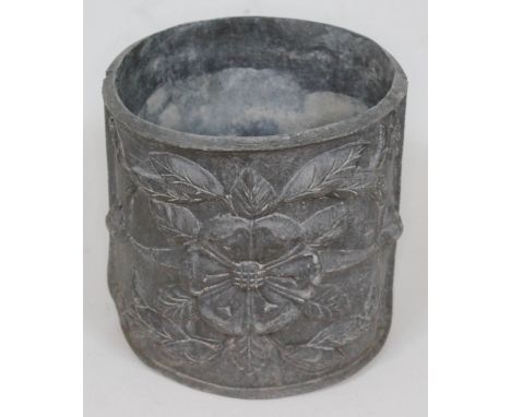 A 19th century lead planter of cylindrical form and decorated with flowers in relief, diam. 22cm &amp; height 22cm.  