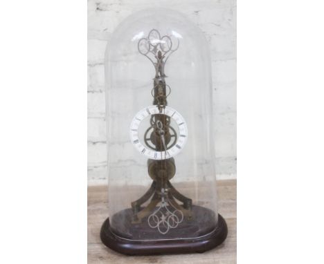 A brass scissor skeleton clock, 20th century, 13cm enamel chapter dial with Roman Numerals, single fusee movement, glass dome