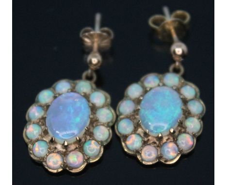 A pair of hallmarked 9ct gold opal cabochon cluster earrings, length 17mm, gross wt. 4.4g.  