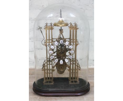 A Gothic revival brass skeleton clock, 20th century, 14.5cm pierced chapter ring with enamel Roman Numerals, single fusee mov