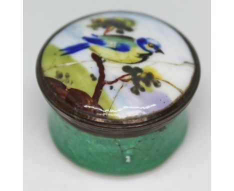 A Bilston type enamel patch box decorated with a blue tit circa 1800, diam. 28mm.  Condition - two cracks to top and hairline
