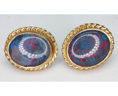 A pair of hallmarked 9ct gold earrings set with opal doublets, gross wt. 4.7g, 15mm x 12mm.  Condition - good, no damage/repa