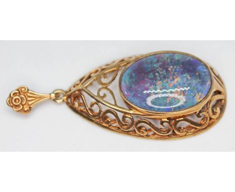 A hallmarked 9ct gold pendant set with an opal doublet,  gross wt. 6.7g, length 50mm.  Condition - good, no damage/repair, mi