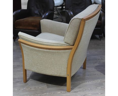 An Ercol ash armchair with visible dovetail joints.  