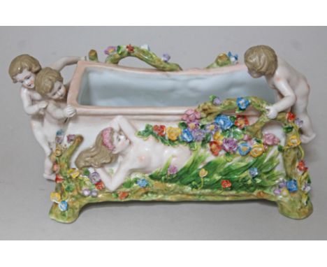A Continental porcelain planter, length 32cm. 