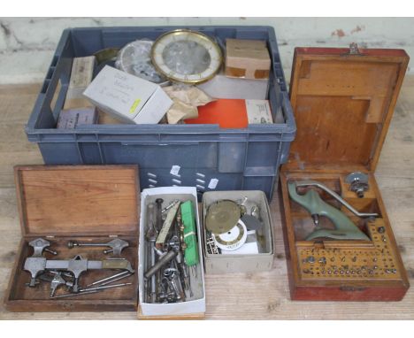 A box of watch and clock parts and tools.  