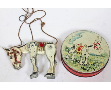 A die-cast Muffin the Mule string puppet and Huntley and Palmers biscuit tin.  