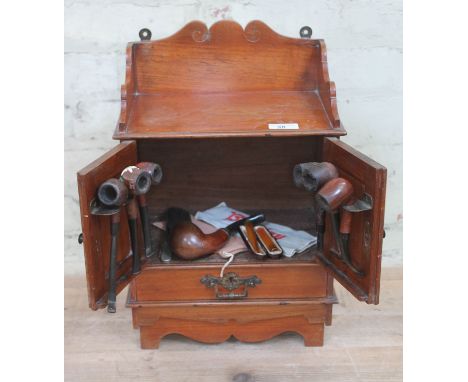 A late Victorian smoker's cabinet, optional wall mounting or free standing, together with contents including a hallmarked sil