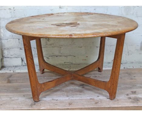 An Ercol blonde elm coffee table, diam. 89cm &amp; height 47cm.  