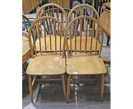 A set of four Ercol blonde elm and beech dining chairs.  