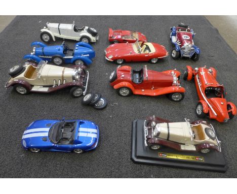 Ten Burago and Maisto large scale die-cast model vehicles; Alfa Romeo, Mercedes Benz and others, two with loose wheels 