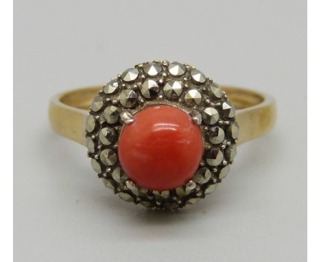 A silver gilt, coral and marcasite ring, N 