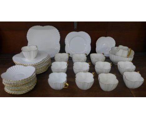 A Foley china tea set; sandwich plate, twelve side plates, eleven saucers and ten cups 