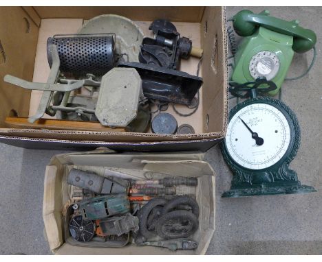 A box with two vintage telephones, Salter Family scales, vintage toys and wooden pipes 