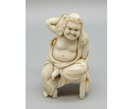 A Buddha netsuke 