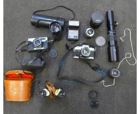 A collection of camera equipment including Minolta X-300, lenses, a Petri camera and a pair of binoculars 