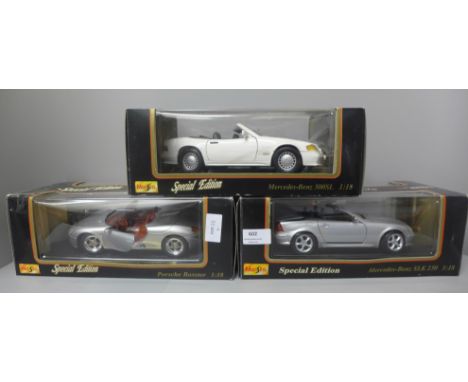 Three Maisto 1:18 scale die-cast model vehicles, Mercedes x2 and Porsche Boxster, boxed 